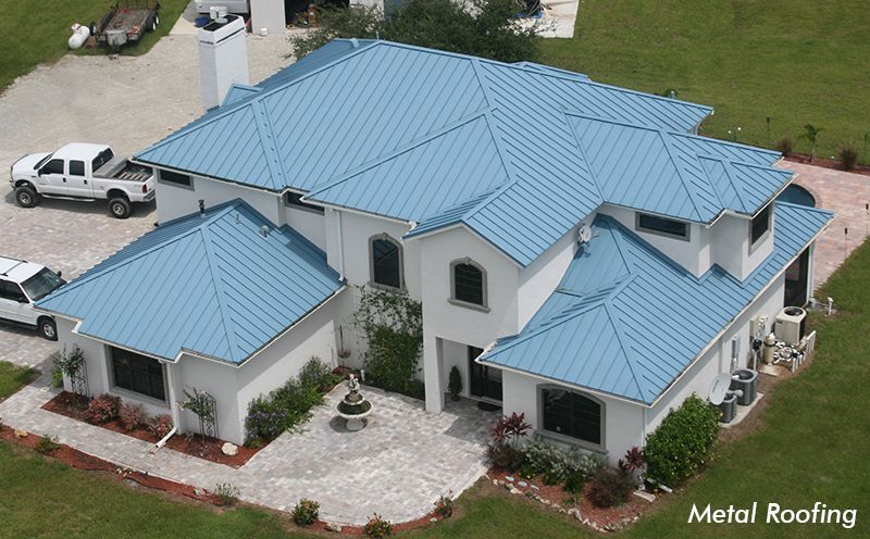 Florida Southern Roofing employees on site during a commercial roof repair. Commercial roof replacement services in Sarasota, FL Florida Southern Roofing And SheetMetal 